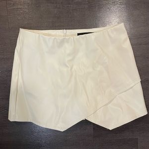 Asymmetrical white leather mini skort